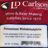 LD Carlson Potassium Metabisulfite with wine bottles