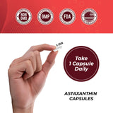 Leaping Lynx Astaxanthin capsules on a wooden table