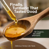 Leefy Turmeric Liquid Supplement in a glass with honey-like texture