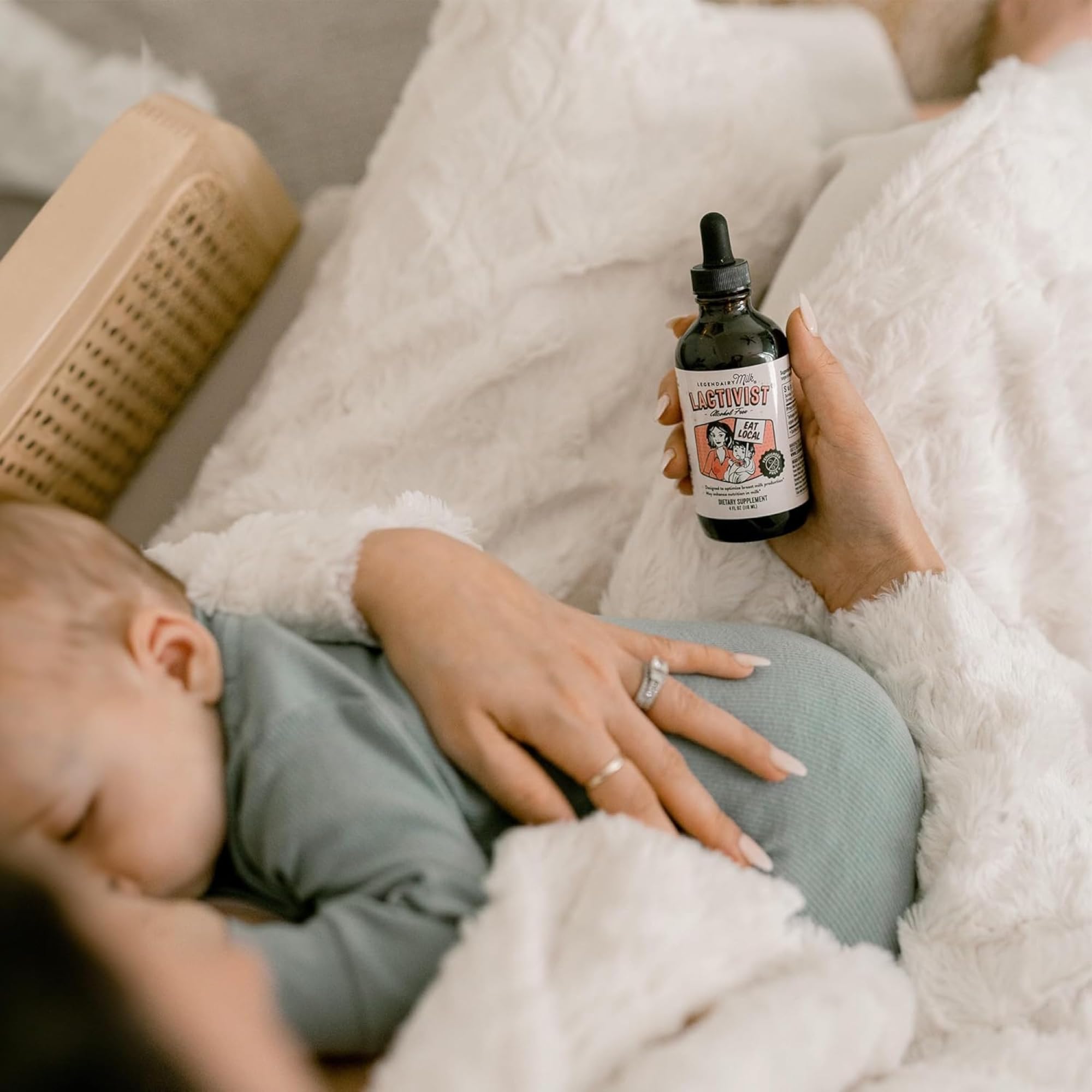 Legendairy Milk Lactivist Drops with a breastfeeding mother