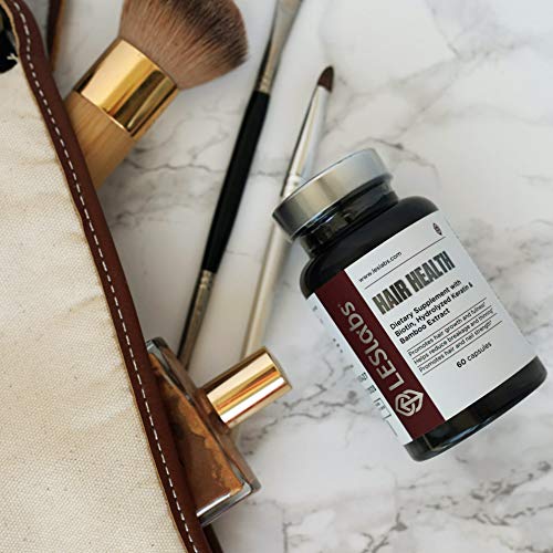 LES Labs Hair Health Biotin Supplement on a wooden table