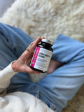 LES Labs Women's Support Supplement on a wooden table