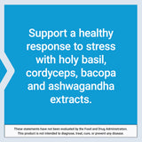 Life Extension Adrenal Energy Formula capsules on a wooden table