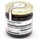 LIFEMEL Zuf Globus EnergyMEL Honey Supplement 4.2 oz on a wooden spoon