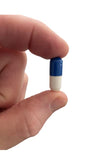 Lifestyle shot of PROOPTIC Lutein capsules on a wooden table