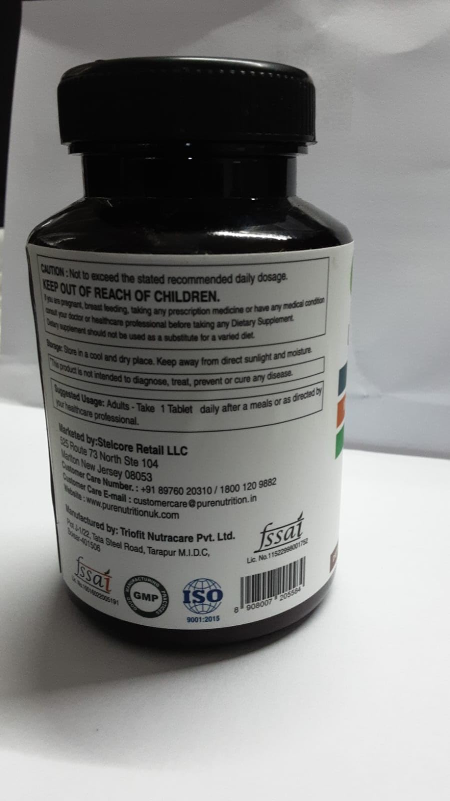Lifestyle shot of PURE NUTRITION Ultra Calcium Citrate 1250 mg with a glass of water