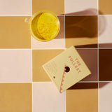 Lifestyle shot of Saffron Latte on a kitchen counter