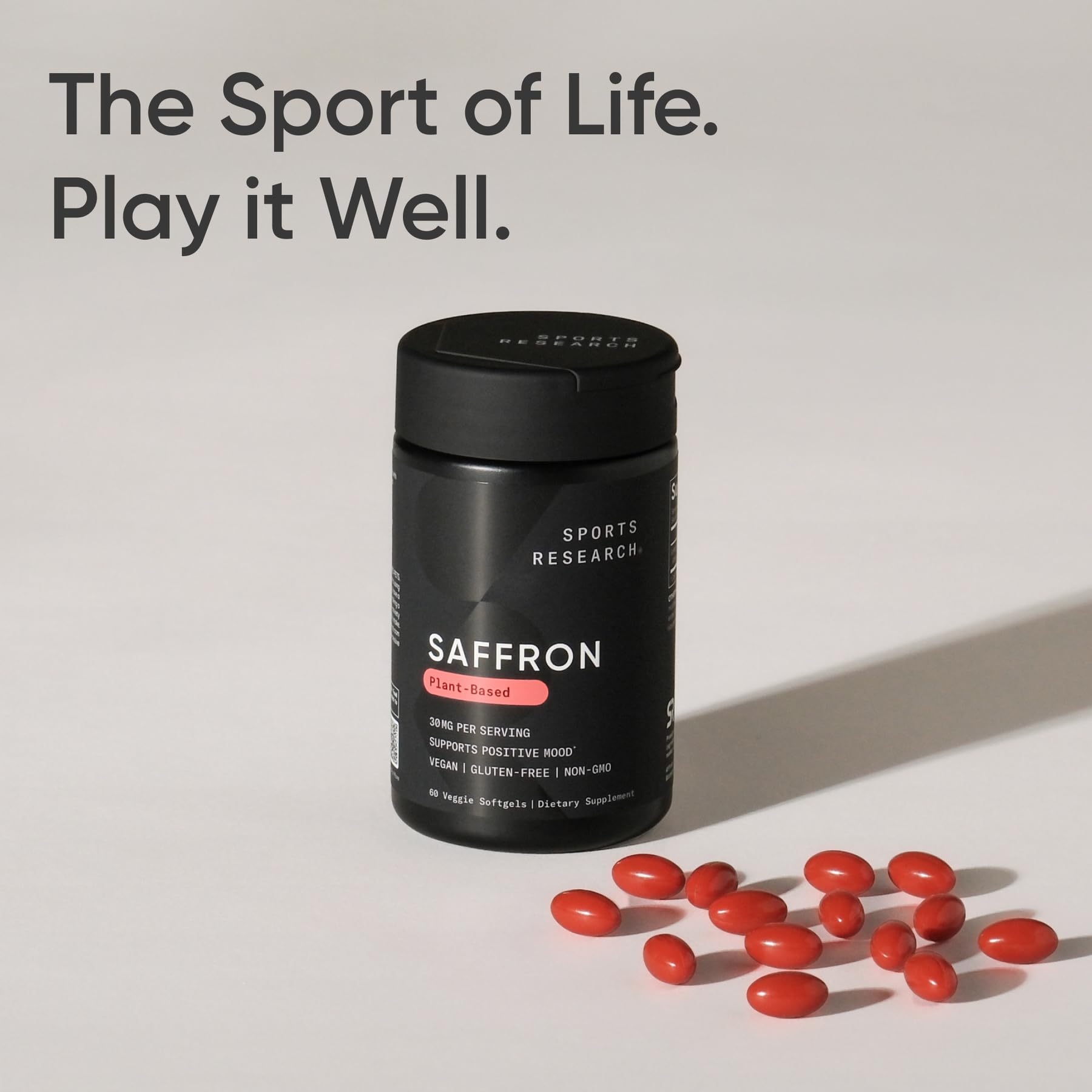 Lifestyle shot of Sports Research Saffron Supplement capsules with a cup of tea