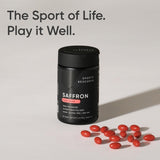 Lifestyle shot of Sports Research Saffron Supplement capsules with a cup of tea