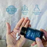 Lifestyle shot of The 'Pause Life Sleep supplement on a bedside table