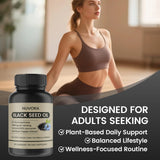 LKNSIH Black Seed Oil Softgels with a glass of water