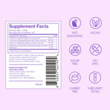 Love Wellness Quick Melt Sleep Strips next to a glass of water