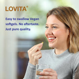 LOVITA Flaxseed Oil bottle with softgels on a wooden table