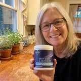 Lubracil Bedtime Wellness for Women capsules with a glass of water