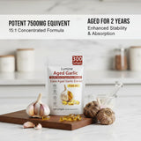 LUMINE Aged Garlic Extract softgels on a wooden surface