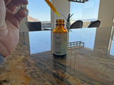 LUV health Neuro Drops on a wooden table with turmeric