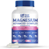 Magnesium Complex Capsules next to a glass of water