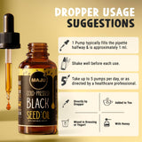 Maju Superfoods Black Cumin Seed Oil 75g on wooden table
