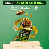 Maju Superfoods Oregano Oil & Black Seed Oil Capsules on a wooden table
