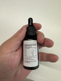 MaxHemp Natural Oil Drops bottle side view showing label