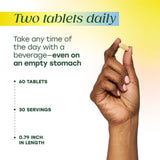 MegaFood Multivitamin for Women 40+ tablets in a hand