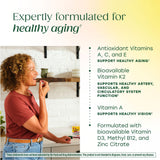 MegaFood Women's 55+ Gummies on a wooden table