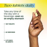 MegaFood Women's Multivitamin 56+ tablets in hand