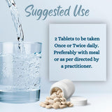 minature Safed Musli Tablets with a measuring spoon