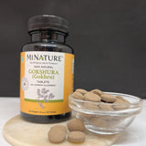 minature Tribulus Terrestris Herbal Supplement tablets in hand