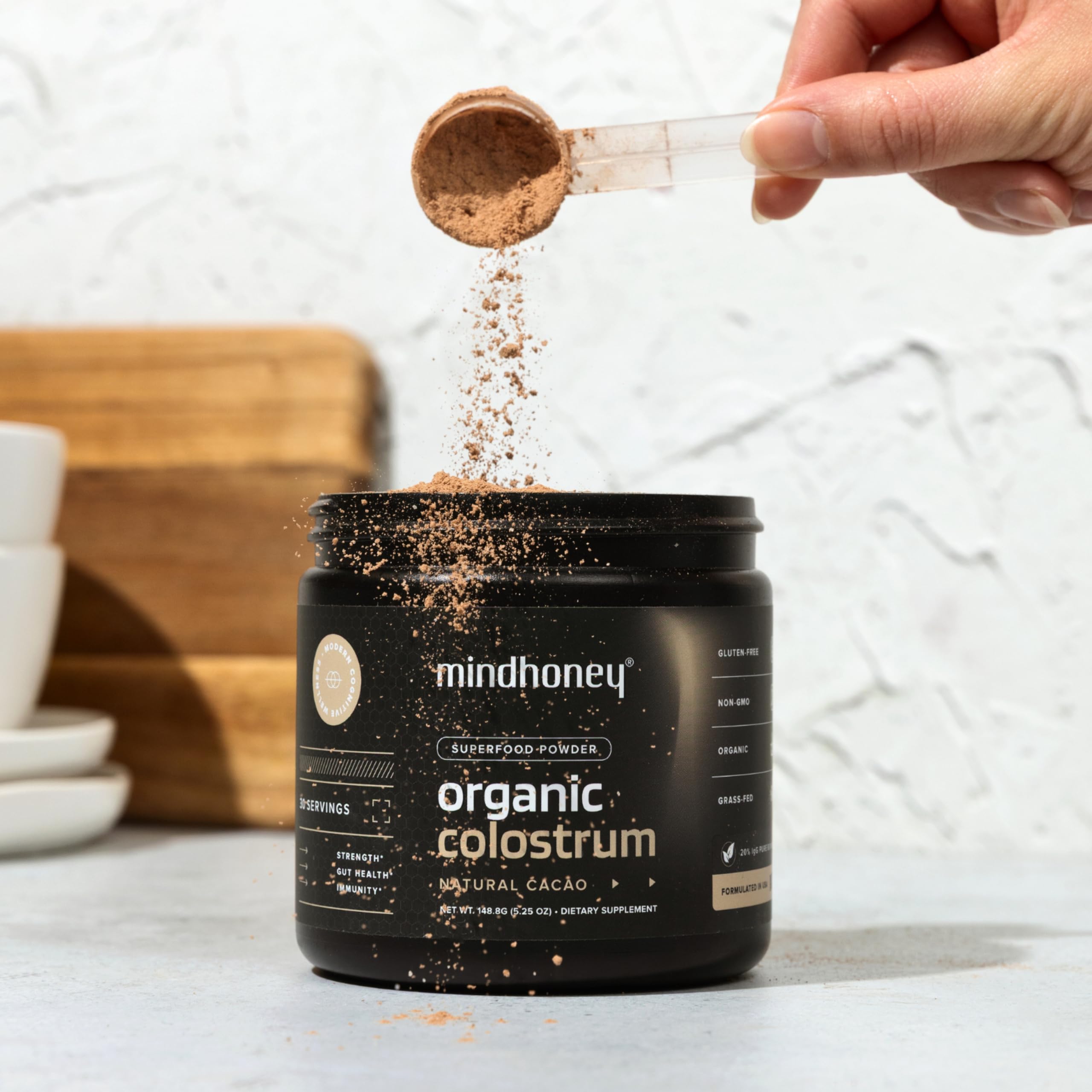 MINDHONEY Organic Colostrum Chocolate Powder in a smoothie