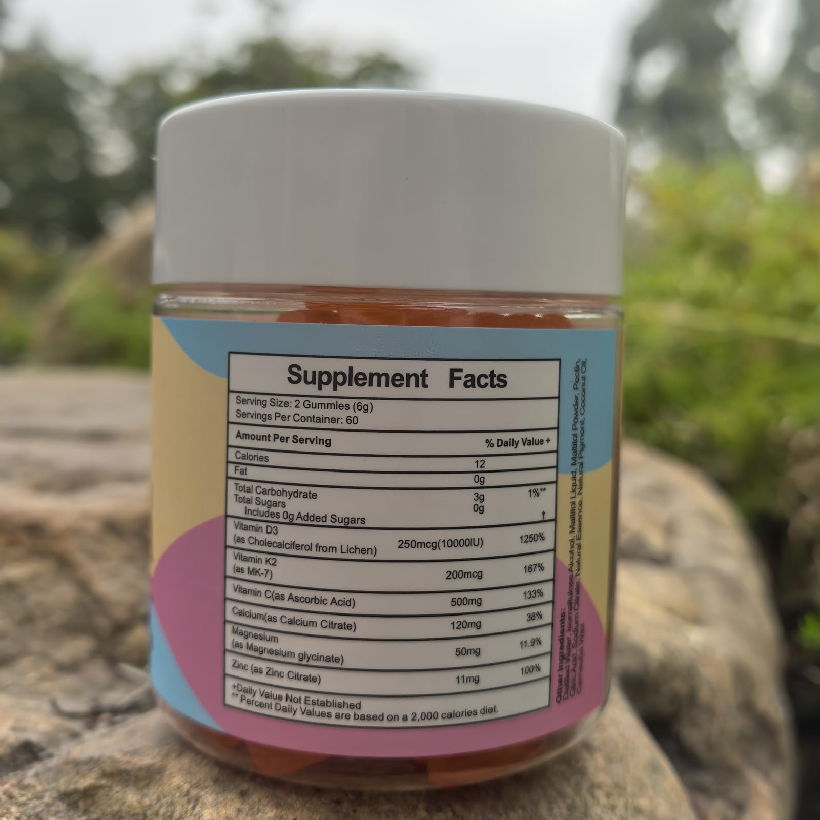 Misyvoing Multivitamin Gummies bottle with two gummies on a table