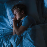 Momentous Elite Sleep Blend 59g capsules with a glass of water