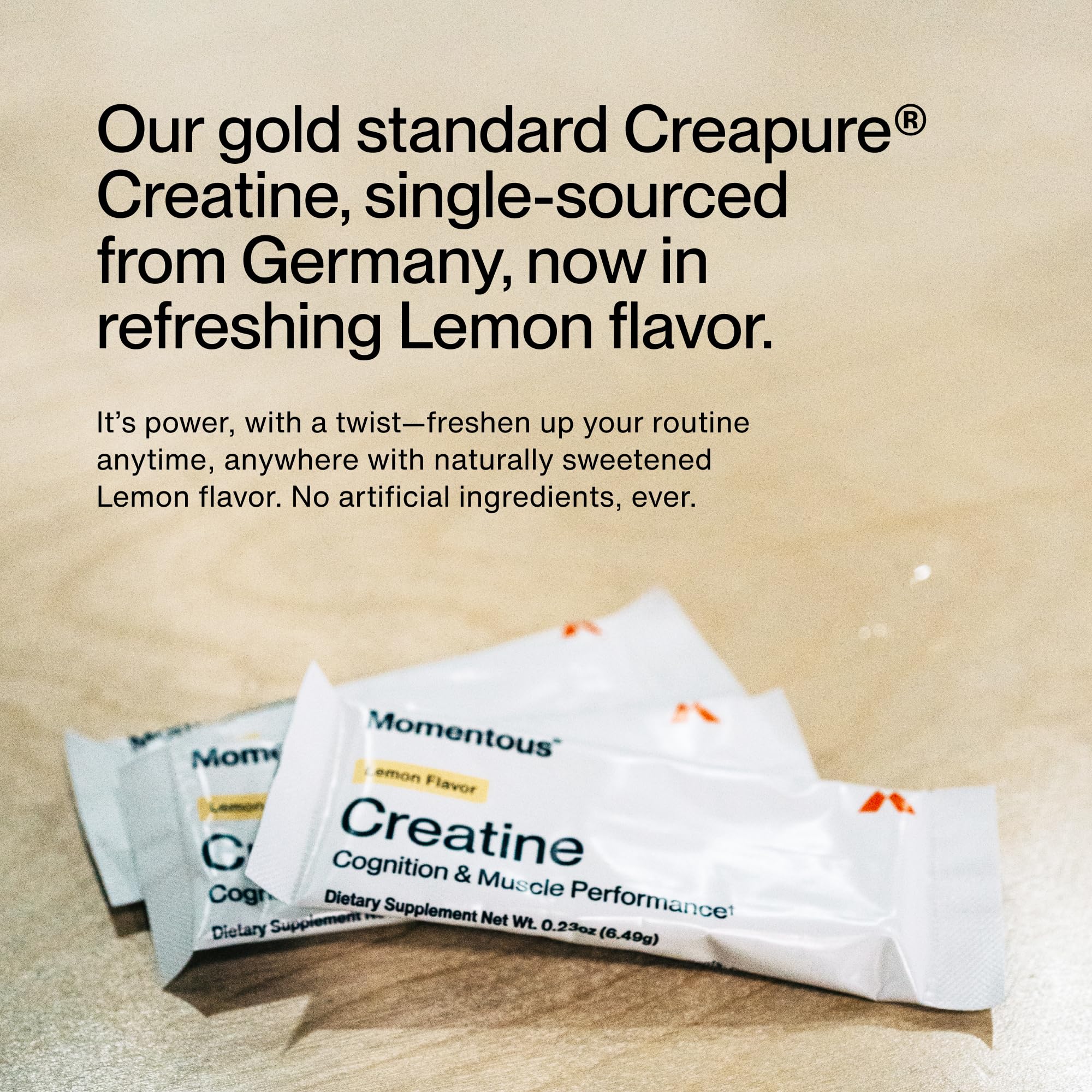 Momentous Lemon Creatine Powder 96g mixed with water in a glass