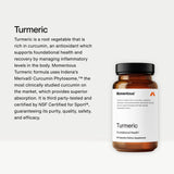 Momentous Turmeric Curcumin Supplement capsules on a wooden surface