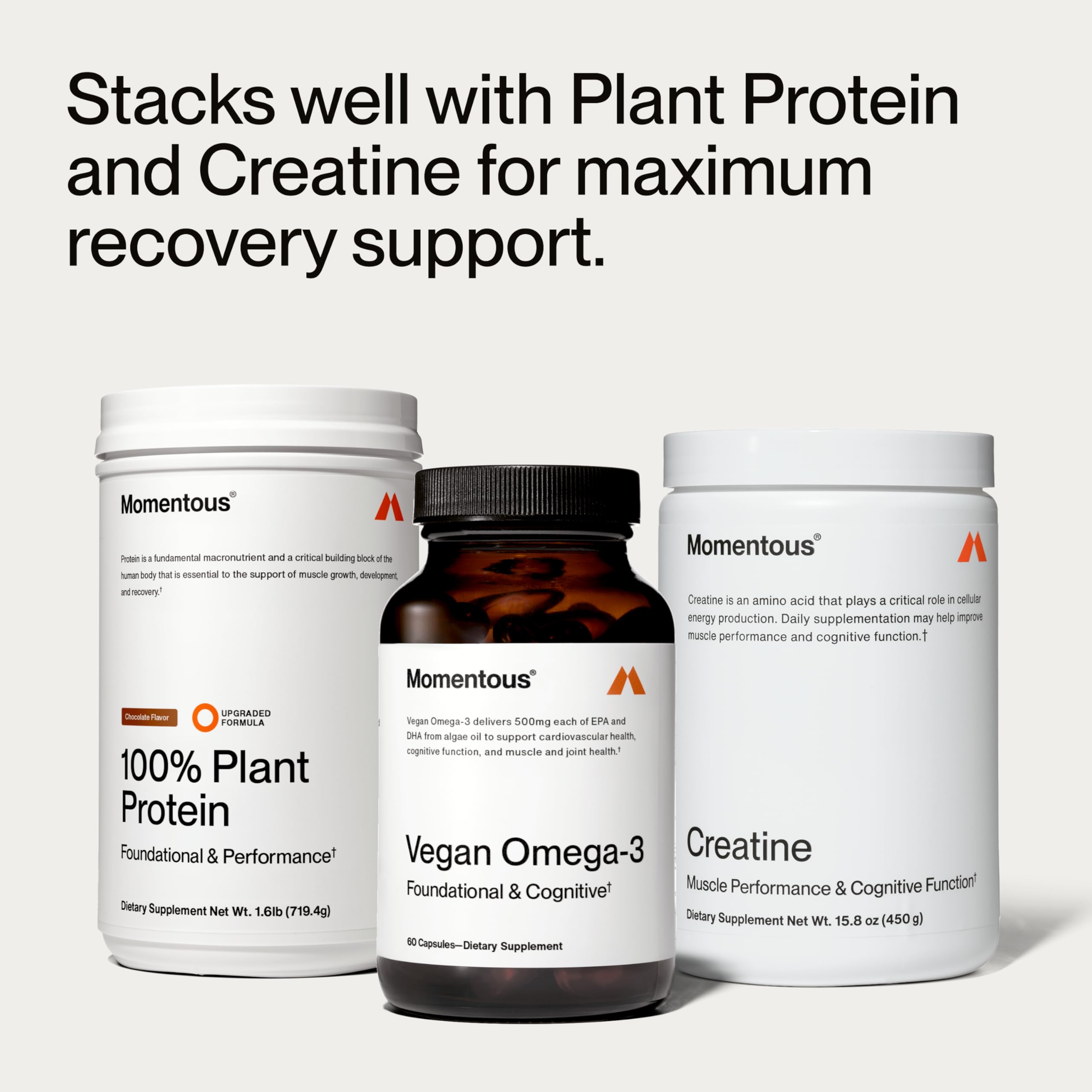 Momentous Vegan Omega-3 capsules on a wooden surface