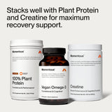 Momentous Vegan Omega-3 capsules on a wooden surface