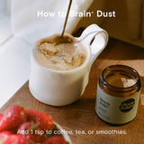 Moon Juice Brain Dust 168g with a cup of tea