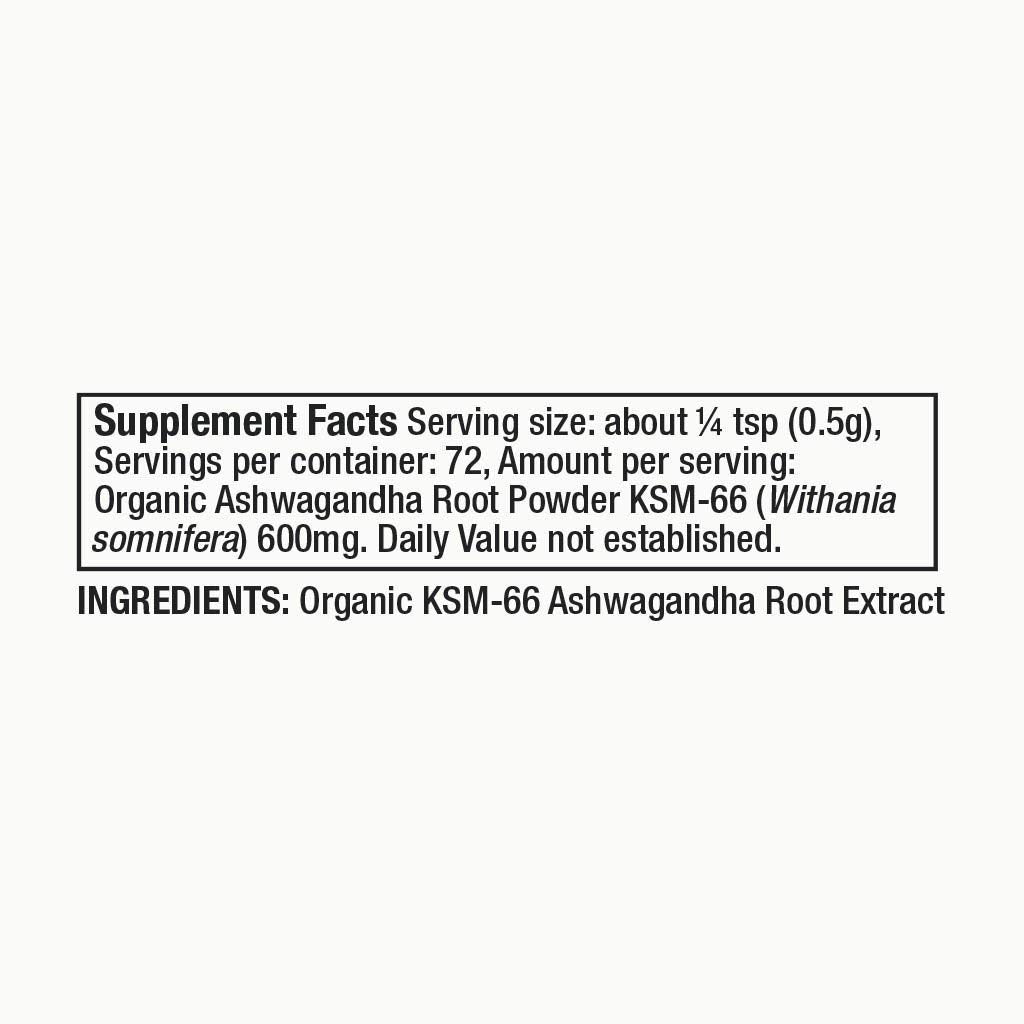 Moon Juice Organic Ashwagandha Powder on a kitchen counter with measuring spoon