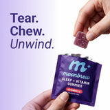 MoonBrew Strawberry Sleep Gummies with a glass of water