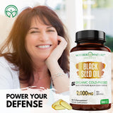 Mother Nature Organics Black Seed Oil Softgels displayed with fresh Nigella sativa seeds