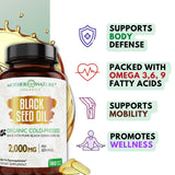 Mother Nature Organics Black Seed Oil Softgels lifestyle scene with a glass of water