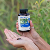 Motherlove More Milk Plus Lactation Supplement capsules in hand