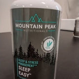Mountain Peak Nutritionals Sleep Easy capsules with a notepad