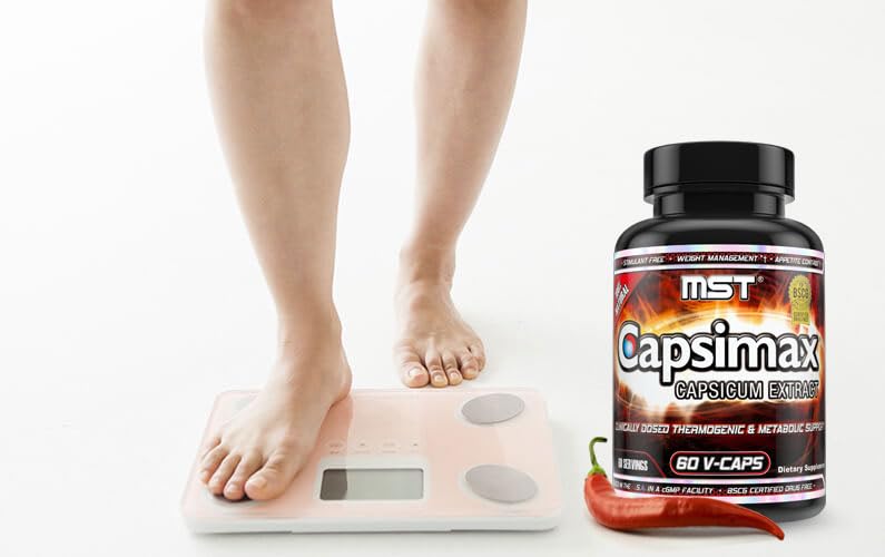 MST Fat Burner Supplement capsules in a hand