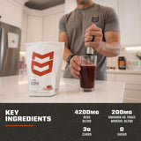 MTN OPS Daily Reds Powder mixed in a glass of water