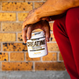 Musclesport Creatine Revolution 300g lifestyle scene with shaker bottle