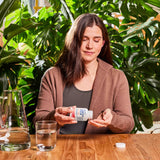 NativePath Krill Oil Softgels in hand for scale