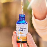 NativePath Vitamin D3 & K2 Liquid Tincture lifestyle shot with fresh fruits