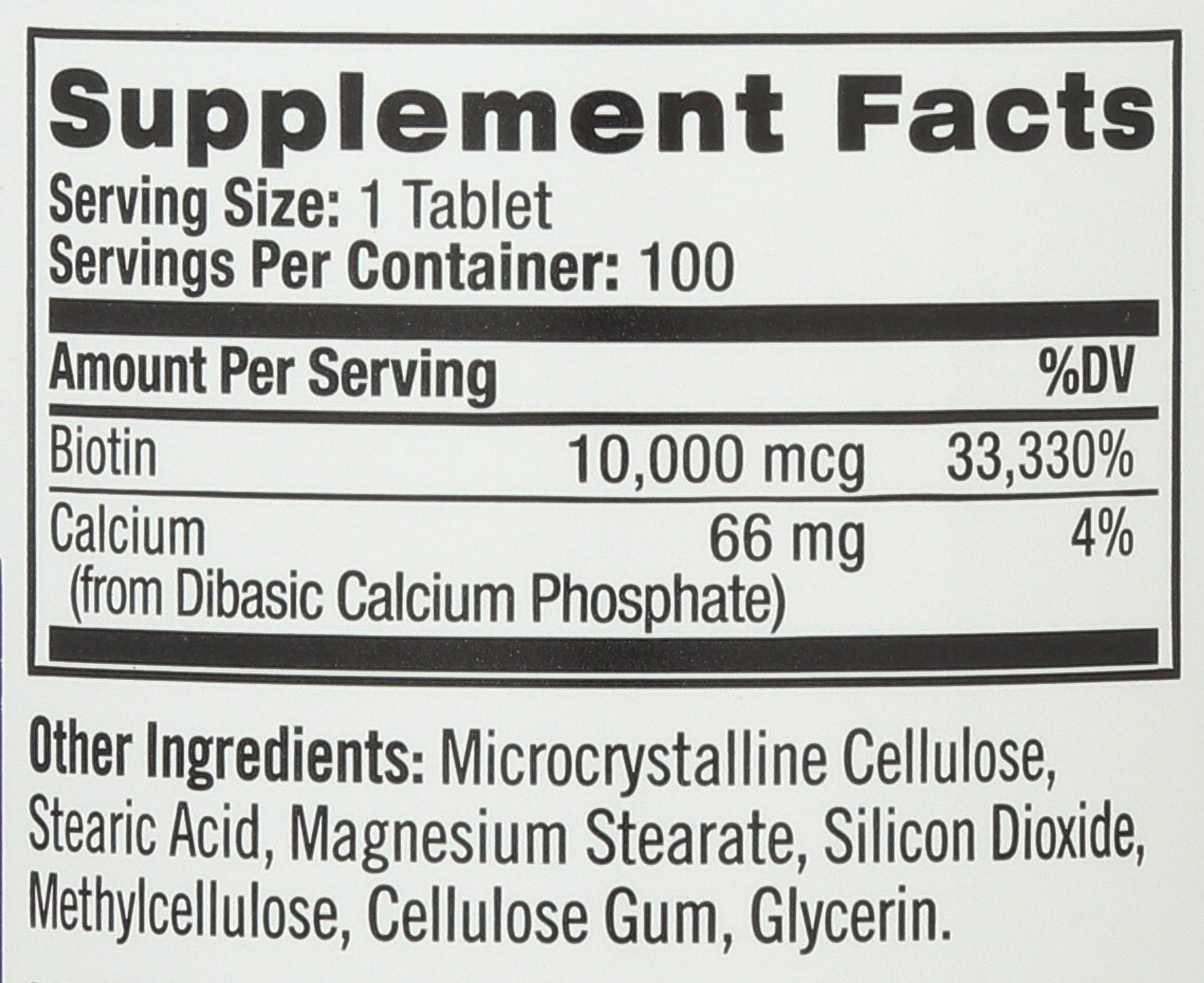 Natrol Biotin tablets on a wooden surface