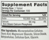 Natrol Biotin tablets on a wooden surface